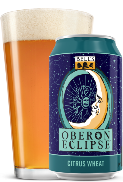 12 oz can of Oberon Eclipse and pint glass of beer
